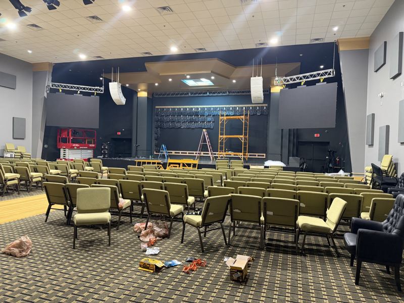 Side screens flown from truss while the center wall is built out